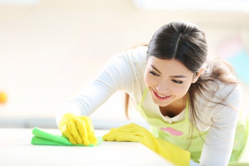 Local technician inspecting a rug before cleaning in SW4